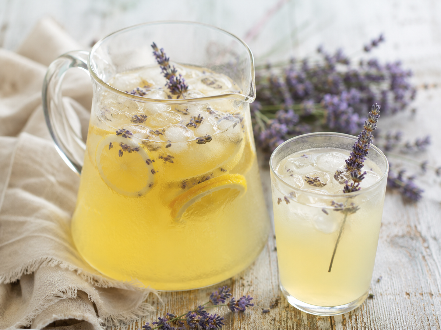 Lavender honey lemonade with lemon slices and lavender sprigs